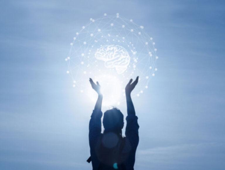 Bioquantum Skin Care image of a person holding up a graphic of a brain