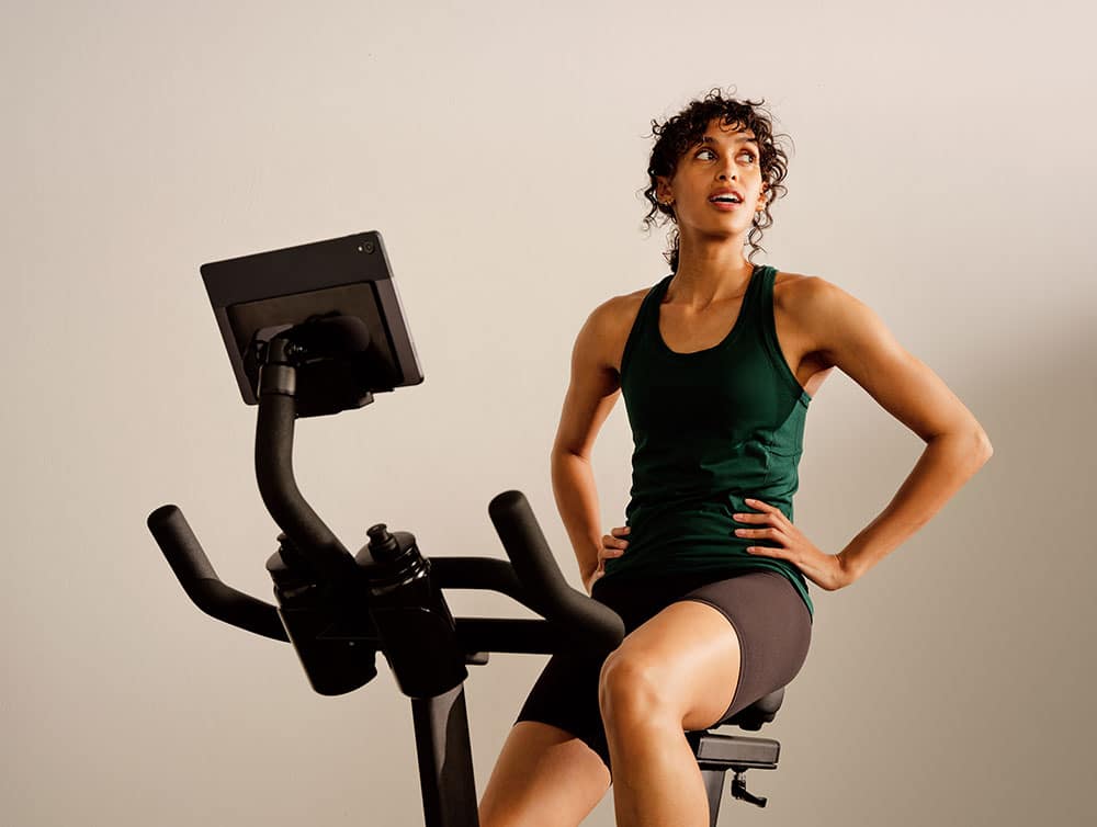 Woman resting after a CAROL Bike workout