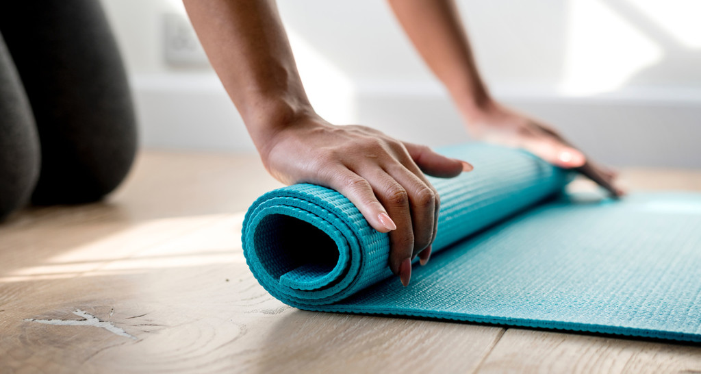 Rolling out mat for meditation