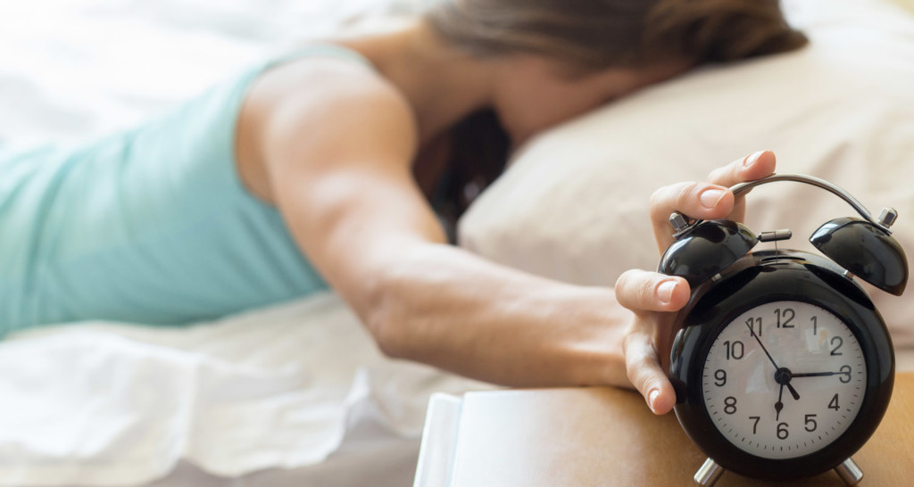 Teen shutting off alarm clock