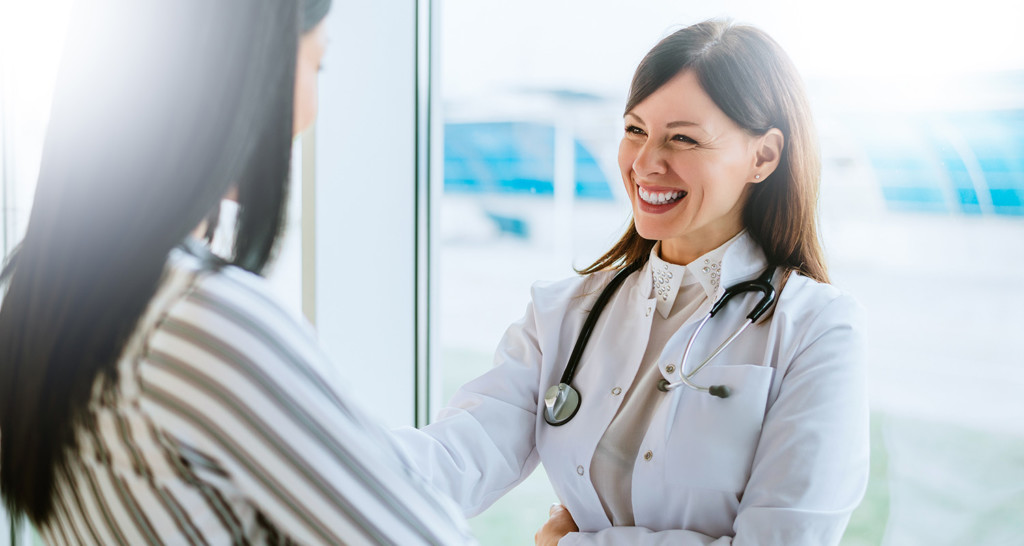 Woman talking with doctor